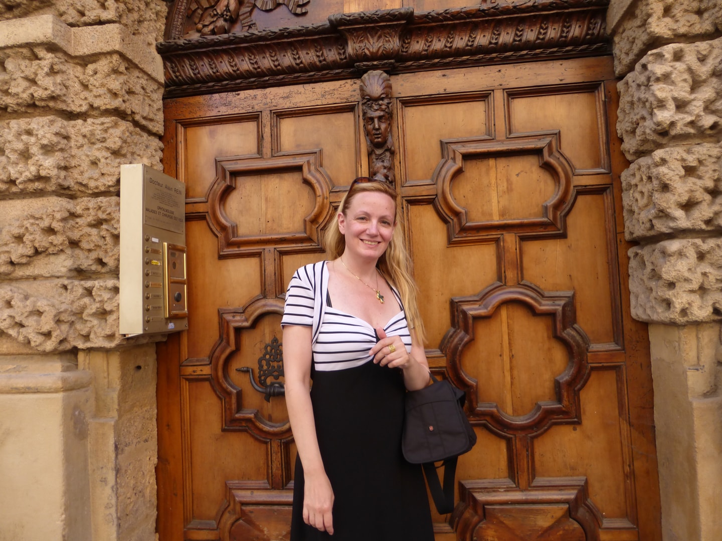 Carol LaHines at an ornate historic doorway