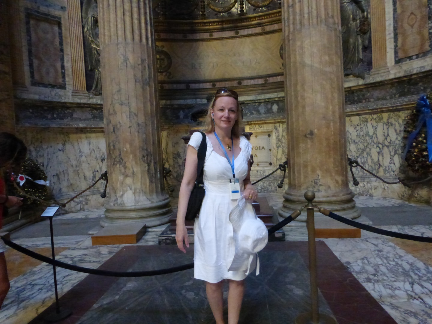 Carol LaHines at a neoclassical museum interior